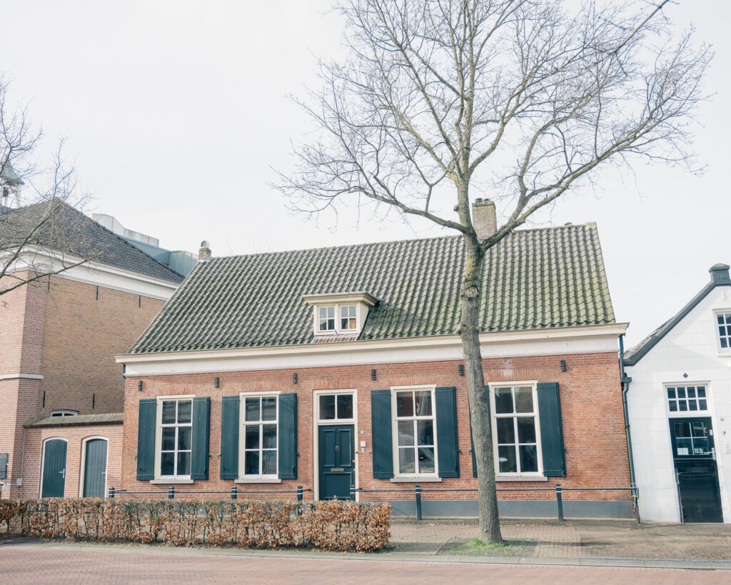 photo of front of brick long facade Dutch monumental home remodelled in 1860 in Nuenen